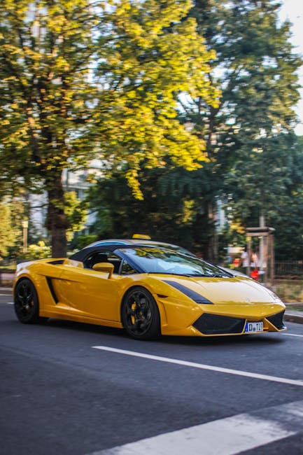 Lamborghini yellow driving on street