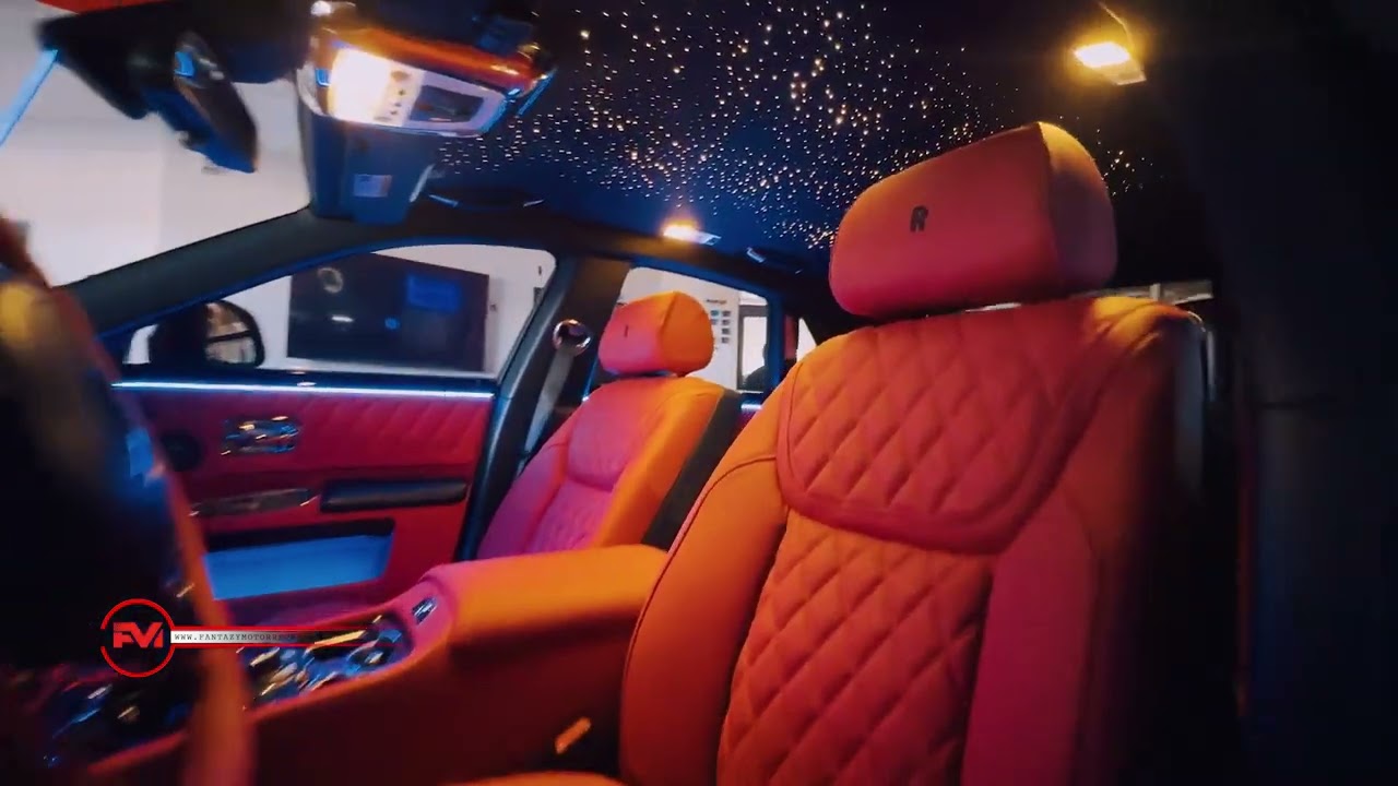Inside Rolls Royce luxury car interior at night