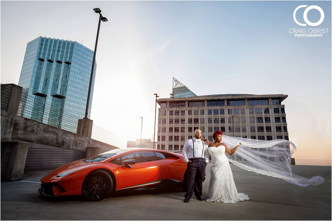 White Ferrari parked outside Miami nightclub with vibrant neon lights