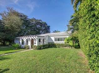 Iconic mid-century modern architecture surrounded by mature landscaping