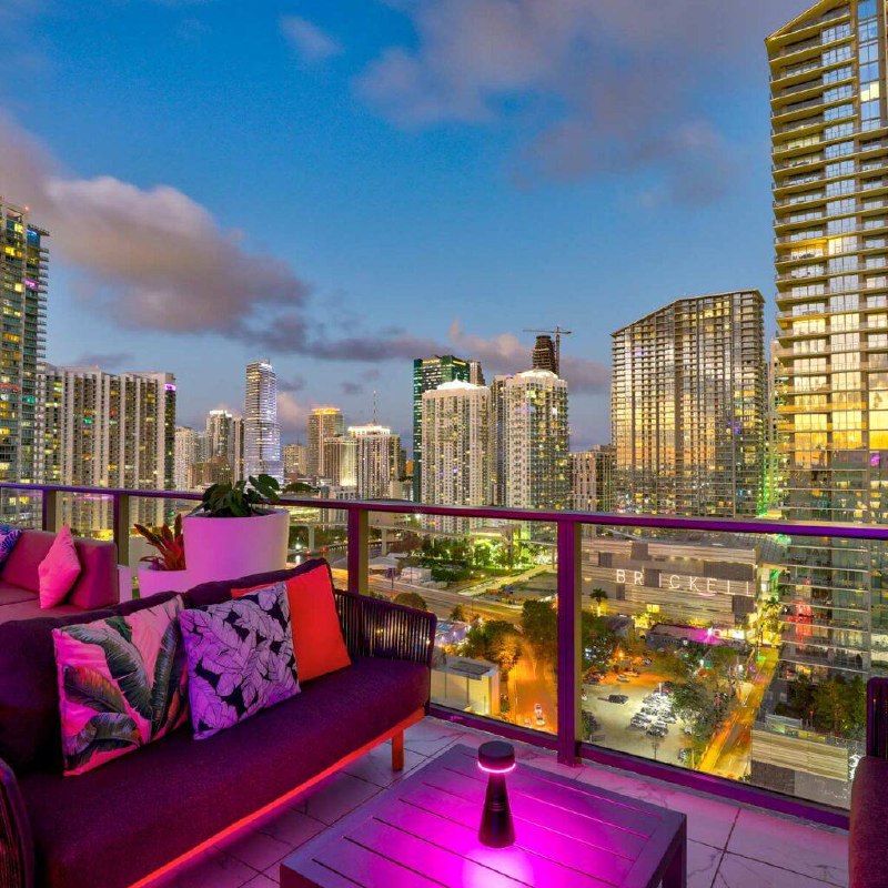 High-rise rooftop bar with city skyline